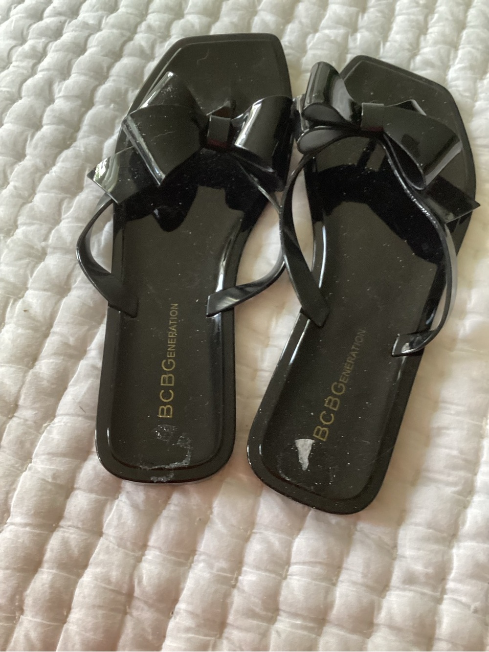 BCBGeneration Black Bow Jelly Flip Flop Sandals